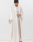 Flow Abaya in Tencel Twill with Piping Detailing in Ivory