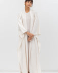 Flow Abaya in Tencel Twill with Piping Detailing in Ivory RTW