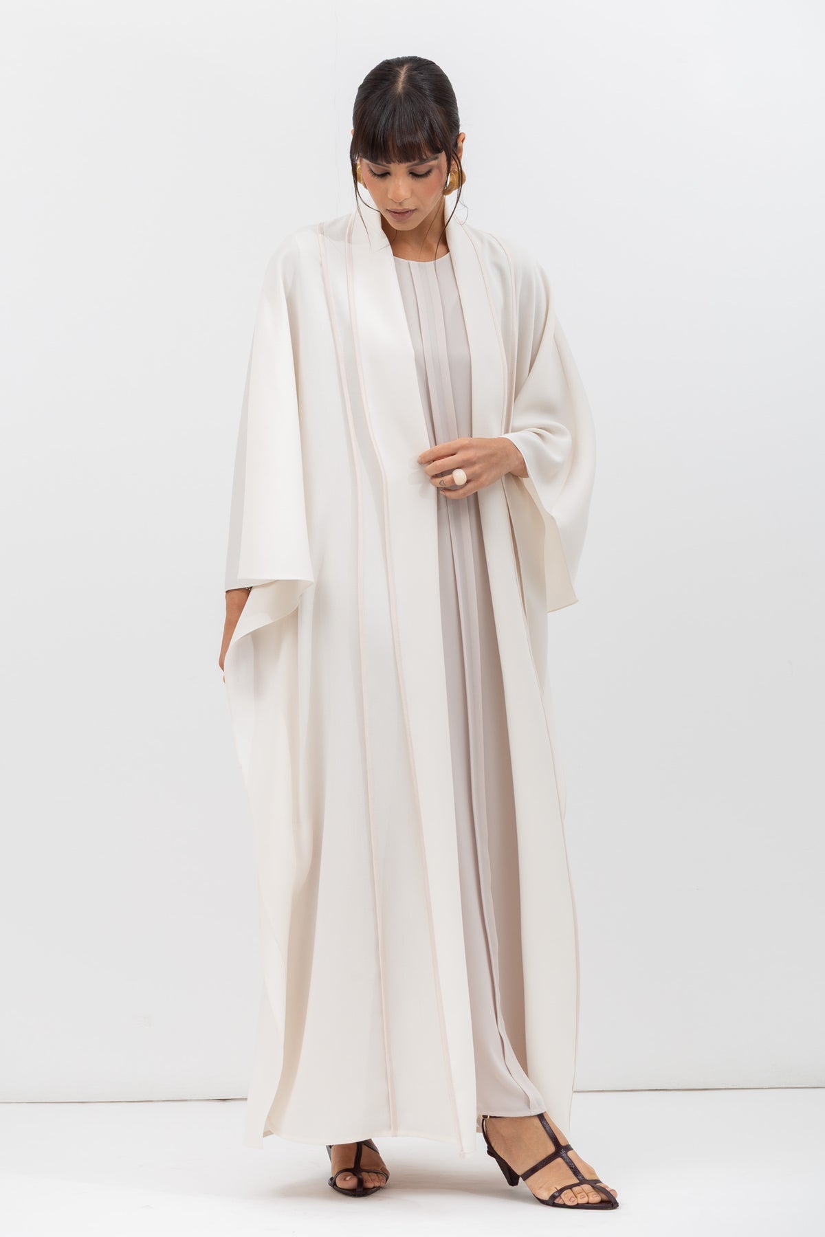 Flow Abaya in Tencel Twill with Piping Detailing in Ivory RTW